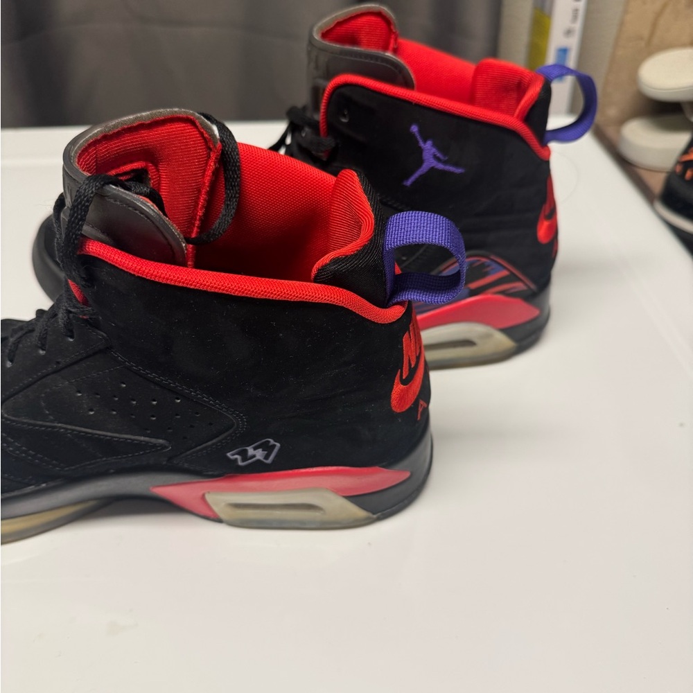 Jordan Black and Red Athletic Shoes with Purple Accents